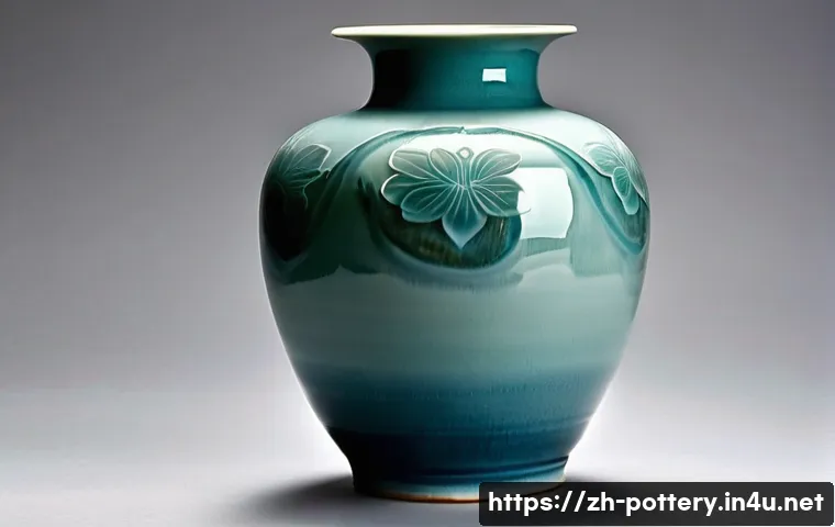 조선시대 도예가 - A finely crafted Korean celadon vase with a smooth, glossy blue-green glaze exhibiting subtle depth ...